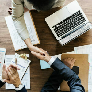 Business people shaking hands together Business people shaking hands together